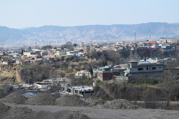City view from top of the mountain in bright sunny day with trees , lake and sky blue cloudy sky