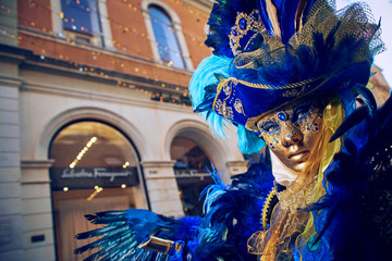 [Venice, San Marco square/Italy - feb. 2020] The anonimous person in the bright traditional...