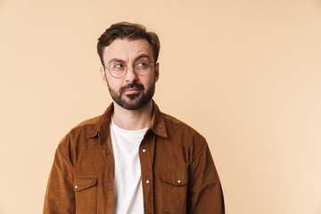 Portrait of a cheerful young arttractive bearded man