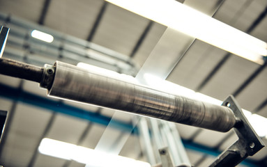 Beautiful metal industrial machinery steel cog rollers in a rustic engineers industrial factory...