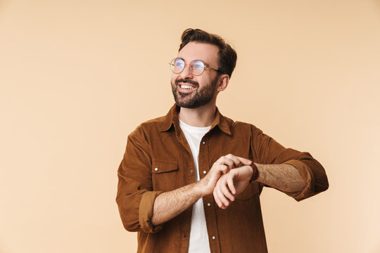 Portrait of a cheerful young arttractive bearded man