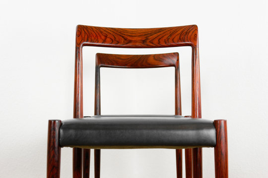 2x danish rosewood CHAIR Danish Design Chairs Mid Century 60s Vintage Dining leather seat wood Modern antique 50s 70s retro original isolated on white wall in modern living room closeup loft
