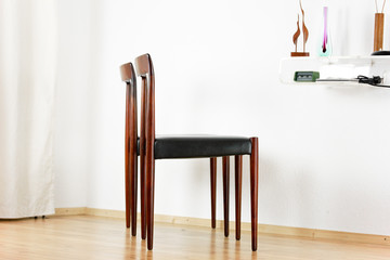 2x danish rosewood CHAIR Danish Design Chairs Mid Century 60s Vintage Dining leather seat wood Modern antique 50s 70s retro original isolated on white wall in modern living room closeup loft