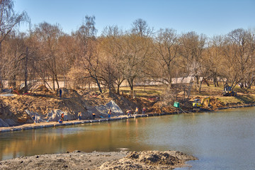 Cleaning of ponds by workers and reconstruction of the park area
