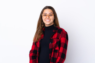 Teenager girl over isolated white background with glasses and happy