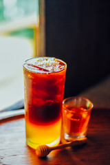 Iced coffee with  fresh honey   or iced americano  In Glass On wood tabel, The drink menu