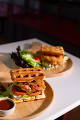 waffles stick with meatball on wooden table