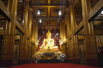 Buddha's statue in golden building at Mae Sot, Thailand