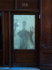 Shadow of a person behind a door, Havana, Cuba