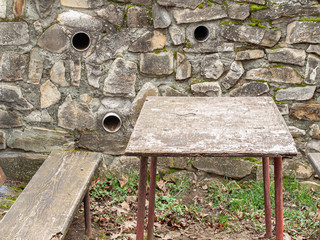 stone wall with seating and ventilation openings