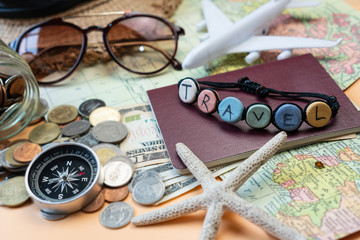 Close up of travel accessories  on orange color background, travel concept. Flat lay.
