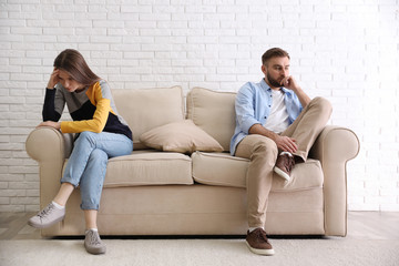 Unhappy couple with problems in relationship at home