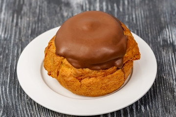 Cake brewed with cream of condensed milk with sugar and chocolate glaze. Russian Sweeten cake