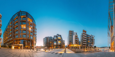 Oslo, Norway. Night View Of Residential Multi-storey Houses In Aker Brygge District. Summer Evening. Residential Area. Famous And Popular Place. Panorama.