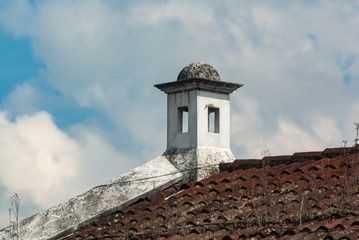 Smokestack detail in colonial house of La Antigua Guatemala, in Central America, Spanish heritage, outdoor architectural detail usually made of brick and tiles.