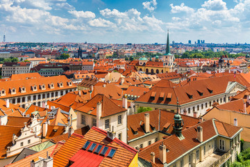 Fototapeta na wymiar Old town of Prague. Czech Republic over river Vltava with Charles Bridge on skyline. Prague panorama landscape view with red roofs. Prague view from Petrin Hill, Prague, Czechia.