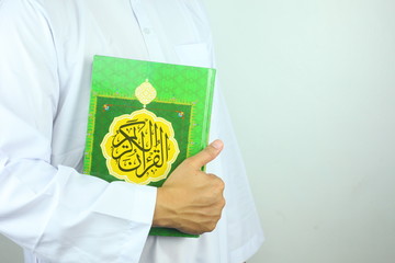 person holding a quran