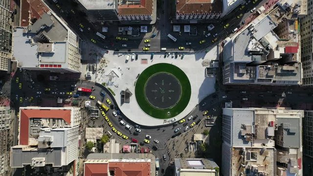 Aerial drone video of recently renovated fountain of famous round square of Omonia in the heart of Athens centre, Attica, Greece