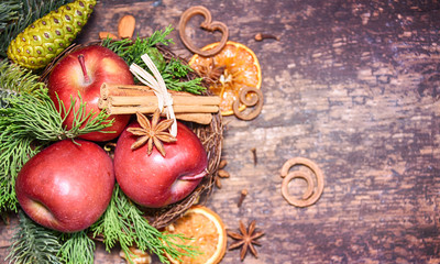 Rustic Christmas background with dry orange and apples