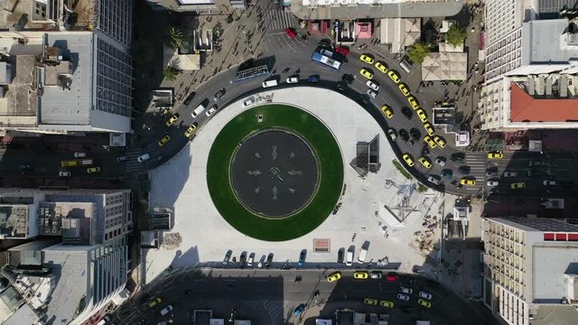 Aerial drone video of recently renovated fountain of famous round square of Omonia in the heart of Athens centre, Attica, Greece