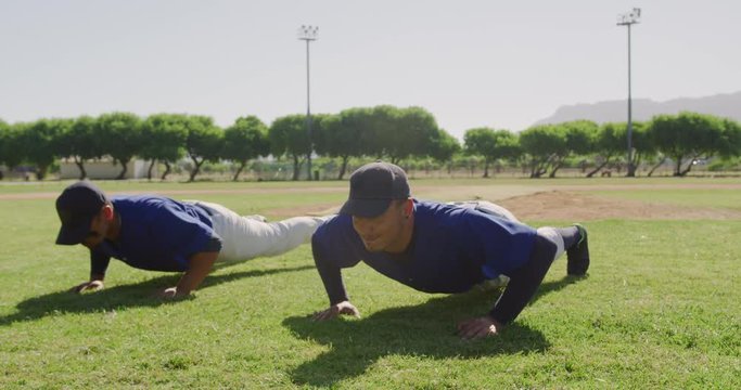 Baseball players making push ups