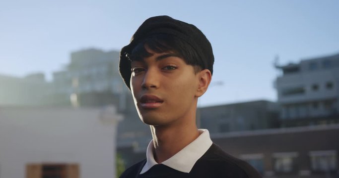 Transgender adult in the street smiling at the camera
