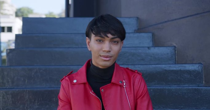 Transgender adult smiling at the camera