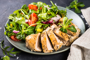Baked chicken with fresh salad.