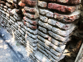 Old brick wall on a sunny day in Tbilisi.
