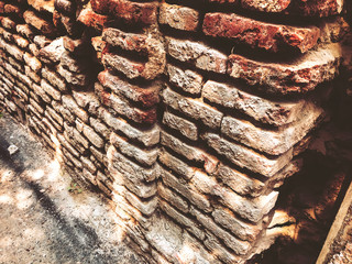 Old brick wall on a sunny day in Tbilisi.