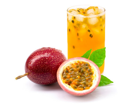 Closeup glass of passionfruit ( maracuya ) juice with passion fruit half slice with green leaf isolated on white background. Healthy drinks concept.