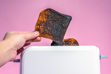 burnt bread toast in the toaster