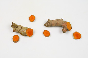 Fresh turmeric root isolated on a white background is an ingredient in turmeric foods and ingredients in skin care products. Turmeric helps the skin to be strong.