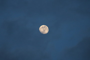 full moon in the sky with clouds