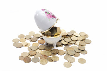 Coins on the ceramic egg
