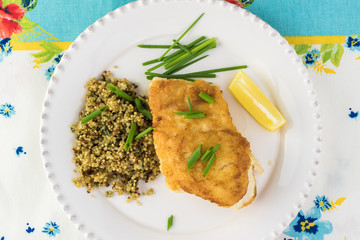 Fried light breaded cod fish.