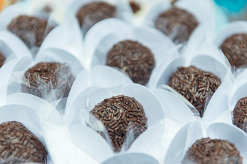 Brazilian chocolate sweet, in a white background with shallow depth of field.
