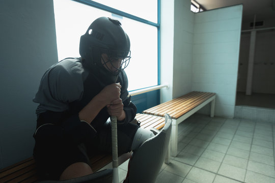Hockey player sitting in the changing room