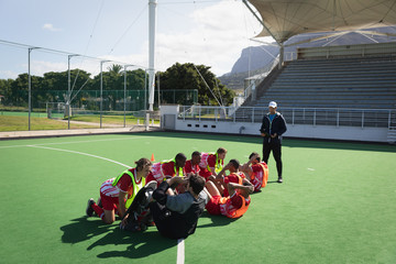 Field hockey players working out on a field