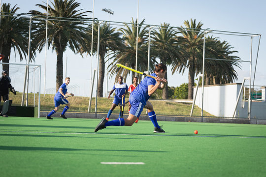 Field hockey players playing hockey