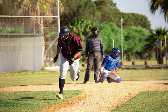 Baseball player running to a base during a match