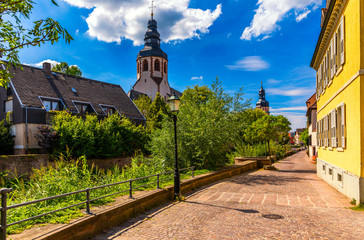 Old city of Ettlingen in Germany with a river and a church. View of a central district of...