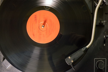 vinyl record. retro look whirling vinyl record player. close up selective focus
