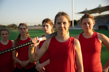 Female hockey players before the match on the field