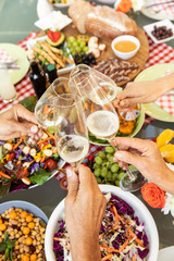 Family eating outside together in summer