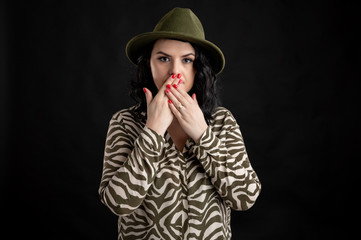 Attractive young woman dressed casually in the speak no Evil