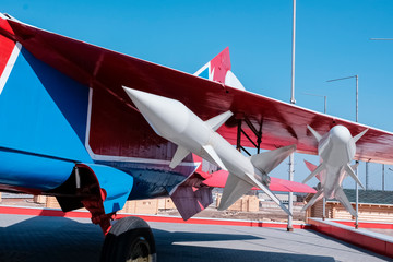 Old military equipment of the USSR and Russia. Rockets under the wing of an airplane. Military. Old...
