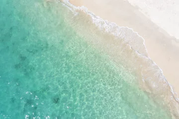 Rolgordijnen Aerial view. Top view.amazing nature background.The color of the water and beautifully bright.Azure beach with rocky mountains and clear water of Thailand ocean at sunny day. © MAGNIFIER