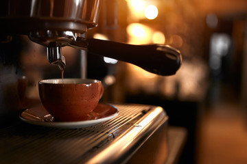 modern coffee machine makes a cup of strong coffee. close up photo, service concept. small business.preparation method