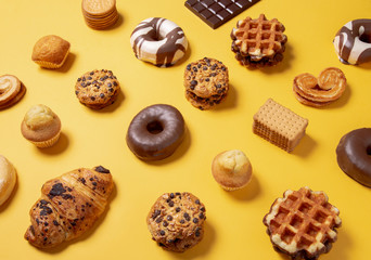 Sweet food pattern on a yellow paper background